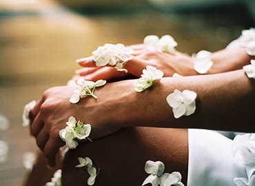 Hands with white flowers